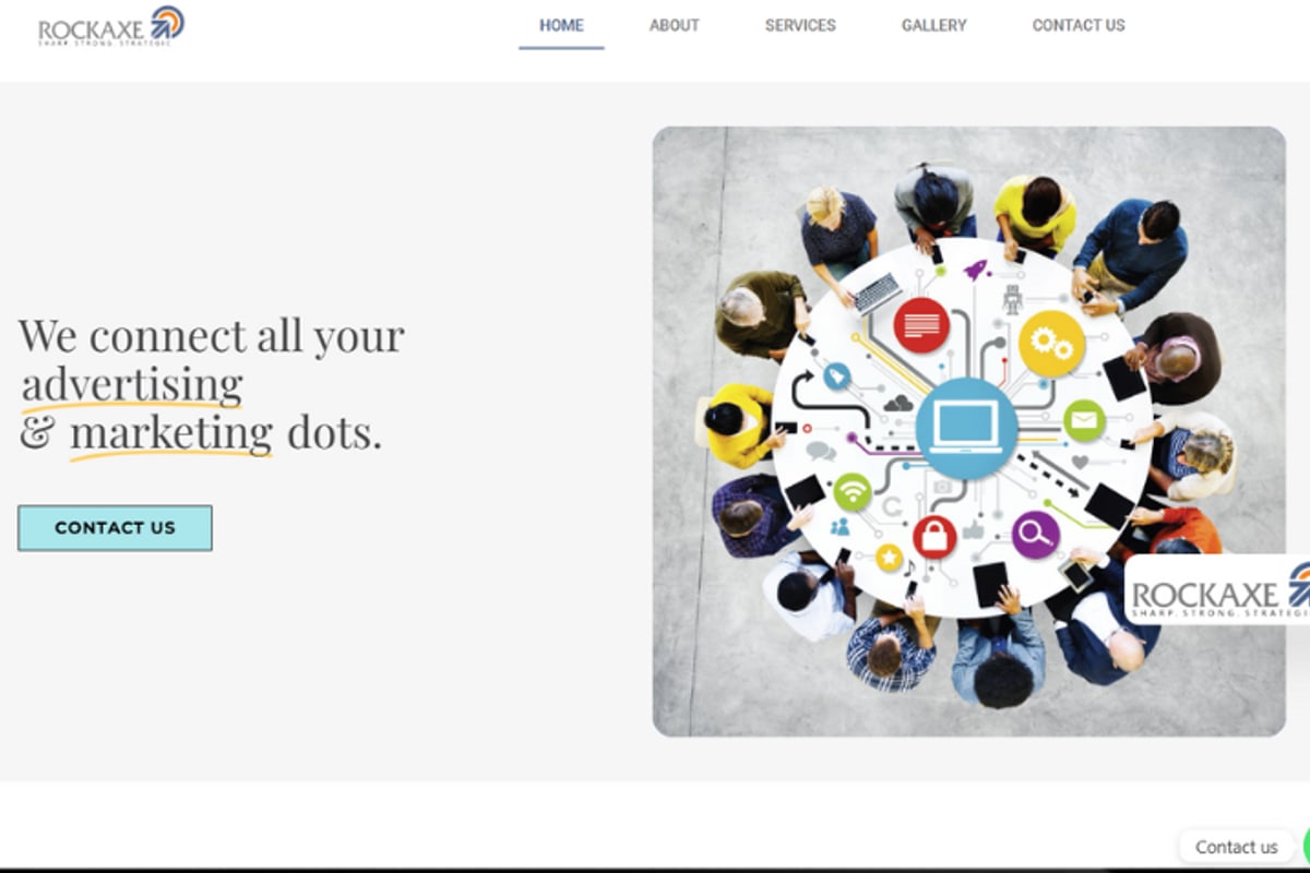 Rockaxe Creative home page: the line We connect all your advertising and marketing dots beside a photo of a team around a table